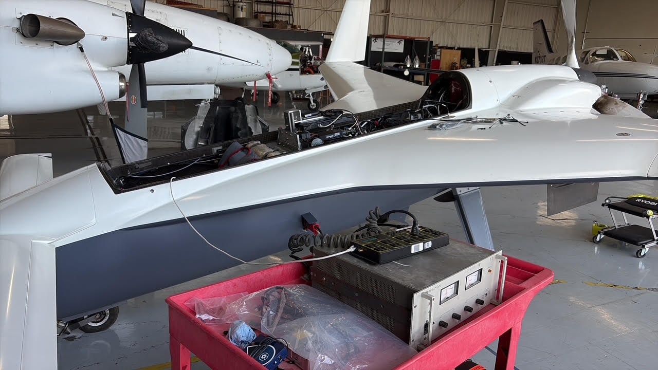 Open Mobius fuselage bay with test equipment installed in the hangar