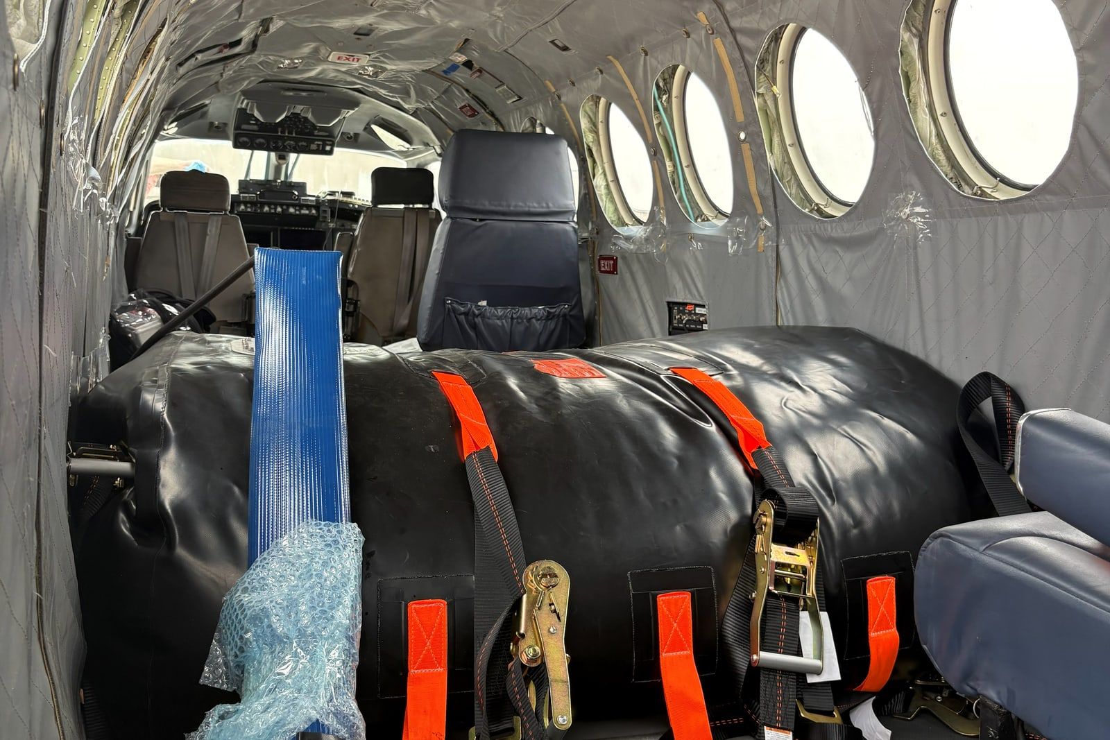 King Air cabin fitted with strapped-down long-range ferry tanks