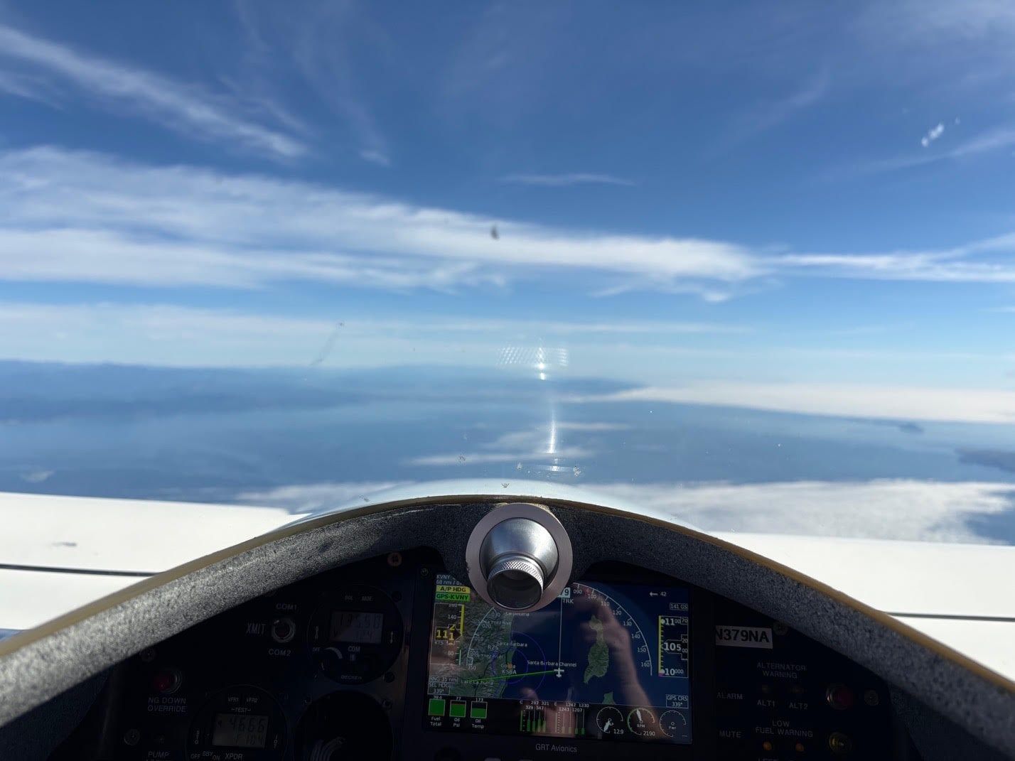 View over the Mobius nose at altitude above a cloud layer off the California coast